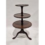 19th century mahogany three-tier dumb waiter, possibly with later adaptions, on turned baluster