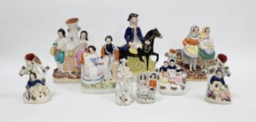 Collection of Victorian pottery flatback figures including a group of Queen Victoria and Prince