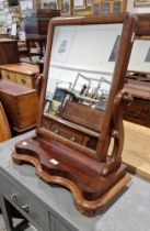 Victorian mahogany dressing table mirror, the swing mirror of rectangular form on scroll-shaped