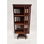 Early 20th century mahogany revolving bookcase, three tier, on castors, 110cm high x 50cm wide x