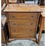 Reproduction mahogany small chest of four long graduated drawers with brass drop ring handles and