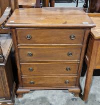 Reproduction mahogany small chest of four long graduated drawers with brass drop ring handles and