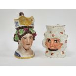 English creamware bacchic moulded jug decorated with a satyr mask and a Staffordshire pearlware