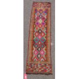 Eastern wool kelim runner with rows of chevrons centred by lozenges with greek key motifs in multi-