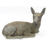 Grey-painted cast lead garden model of a doe, modelled recumbent, 48cm long  Condition Report