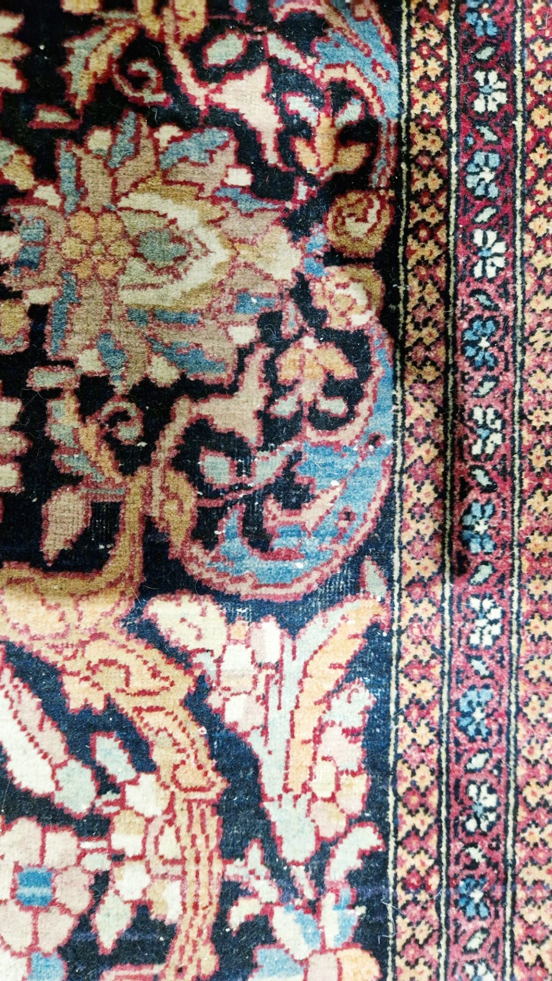 Eastern wool rug of Persian design, having black arabesque to the cherry red field with allover - Image 13 of 32