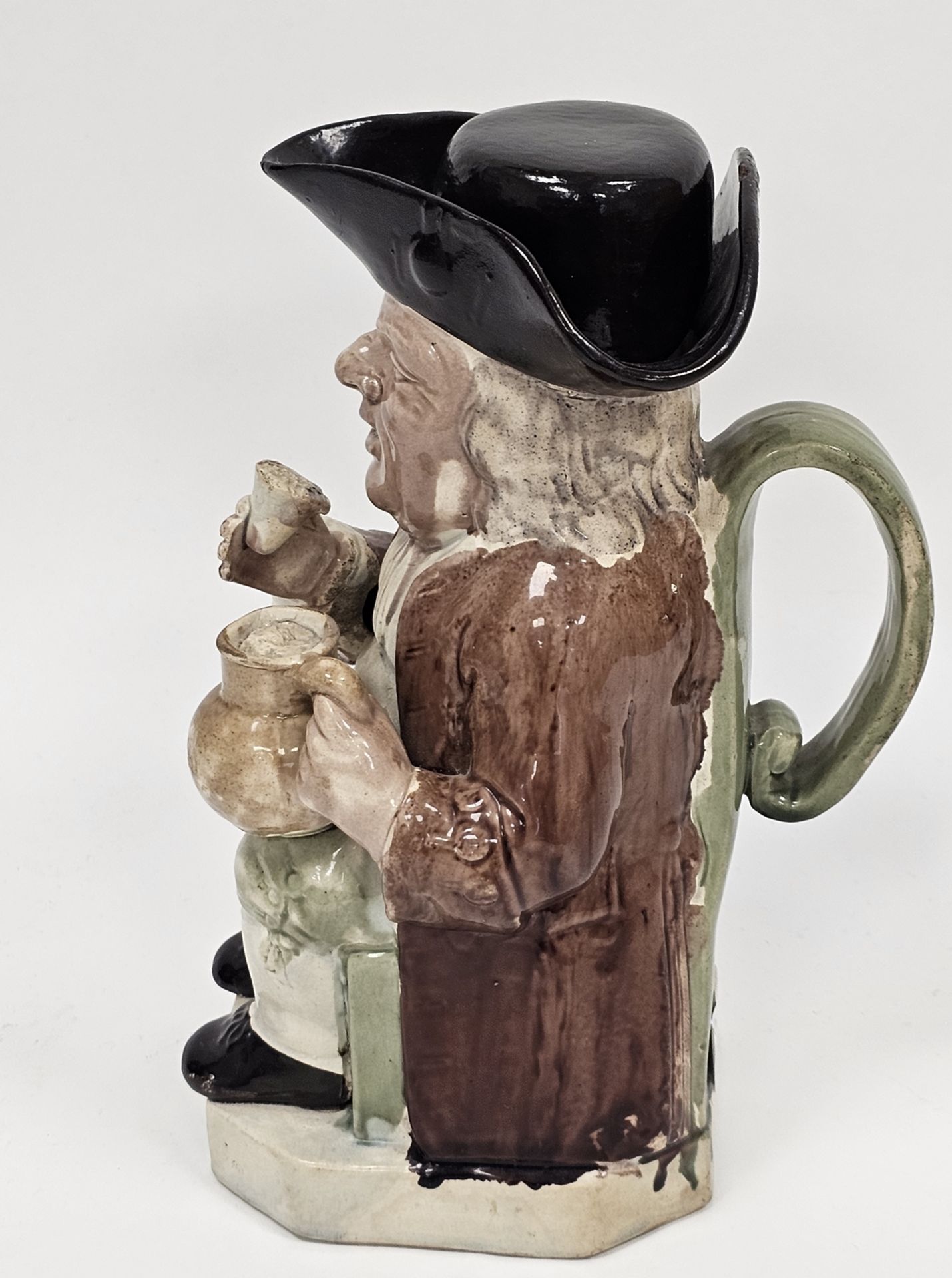 Late 18th century Ralph Wood-type creamware toby jug and cover, modelled seated holding a mug of ale - Image 2 of 10