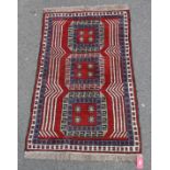 Eastern wool rug with three elephants foot guls, in red, blue and grey, having geometric