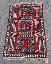 Eastern wool rug with three elephants foot guls, in red, blue and grey, having geometric