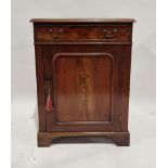 19th century mahogany cupboard, the moulded top above a frieze drawer, with brass swing handles, the