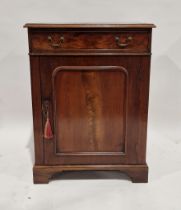 19th century mahogany cupboard, the moulded top above a frieze drawer, with brass swing handles, the