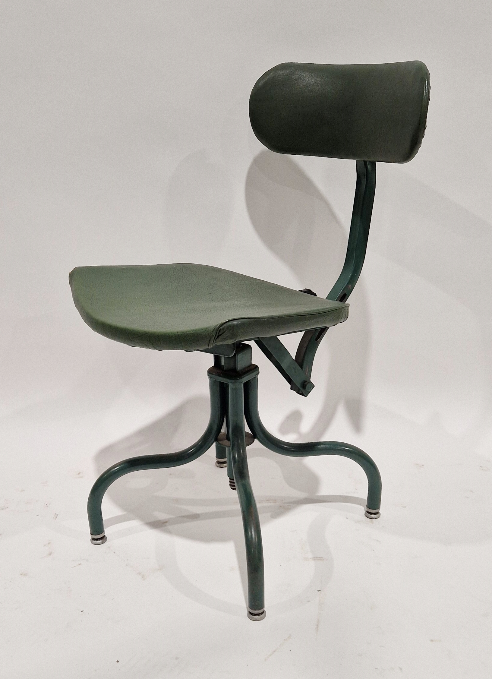 20th century industrialist bu-al machinist's swivel chair on four tubular metal legs, 75cm high