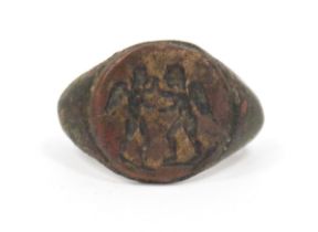 Possibly Roman bronze ring, intaglio engraved with two winged figures