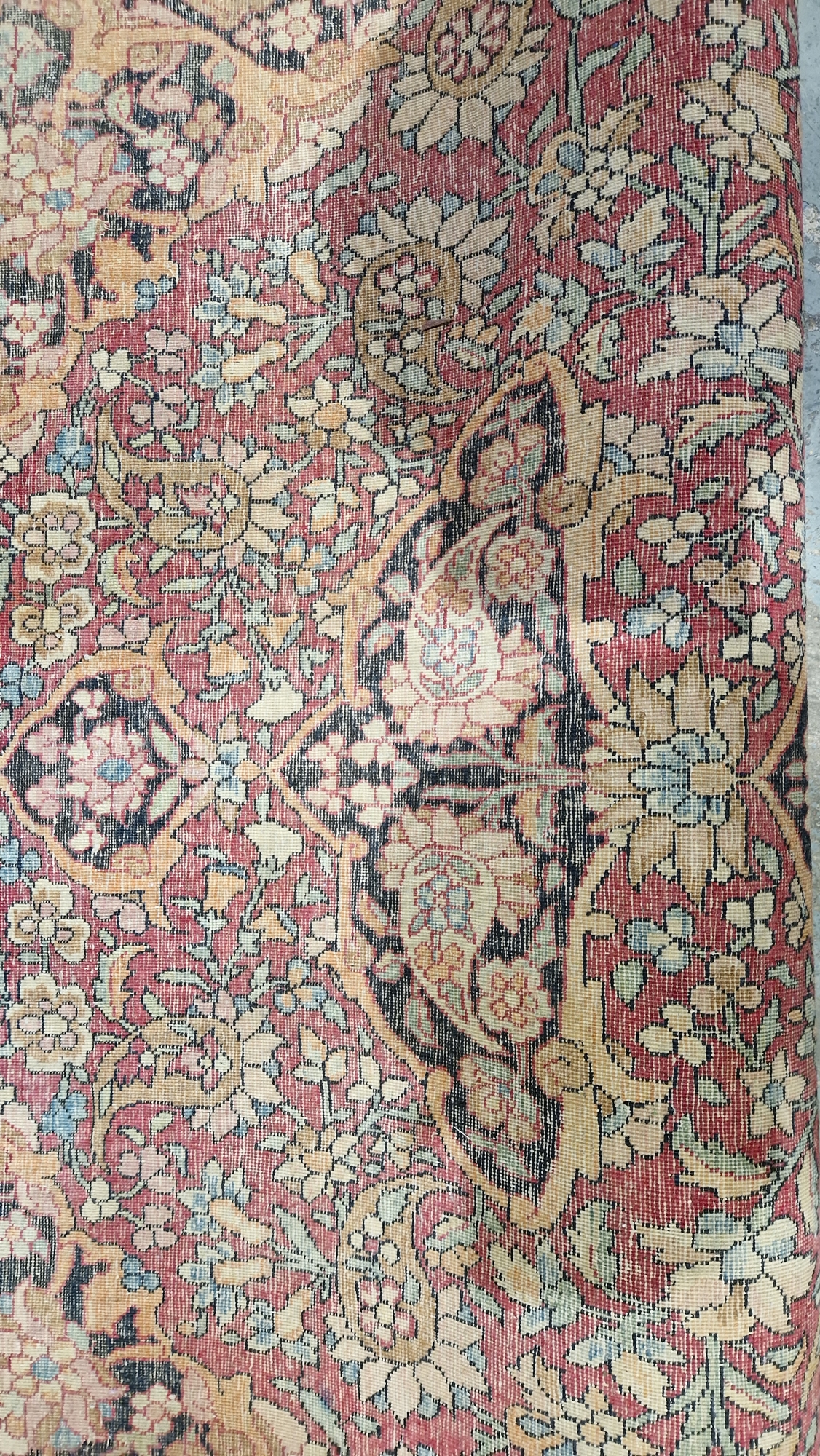 Eastern wool rug of Persian design, having black arabesque to the cherry red field with allover - Image 25 of 32