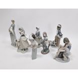 Seven Lladro figures of girls with animals including a ballerina with cat, a girl cradling