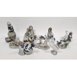 Nine Lladro figures of girls, boys and animals including a girl with kitten and puppy, another