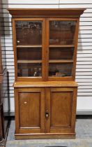 Victorian mahogany bookcase, the two glazed doors opening to reveal two adjustable shelves, raised
