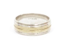 9ct gold and silver banded ring, line engraved, marked to the inside 375 and 925, 5.5g total