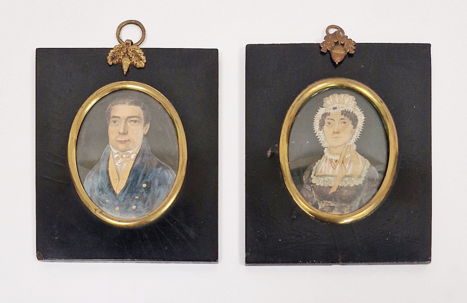 Two 19th century portrait miniatures of lady and gentleman, both mounted in ebonised frames and