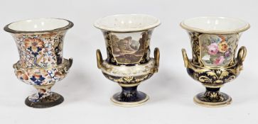 Three Derby porcelain vases, circa 1820, two with iron red cross batons D marks, comprising a