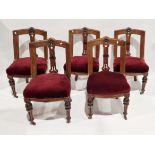 Set of five carved oak dining chairs with burgundy upholstered seats, on turned and carved front