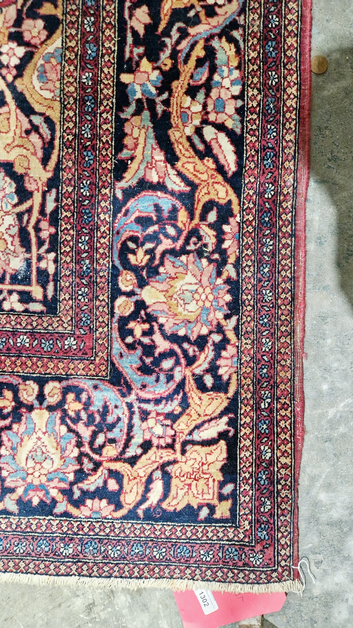 Eastern wool rug of Persian design, having black arabesque to the cherry red field with allover - Image 5 of 32