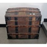 Late 19th century Finnigans dome-topped wooden bound trunk opening to reveal a fitted interior, 63cm