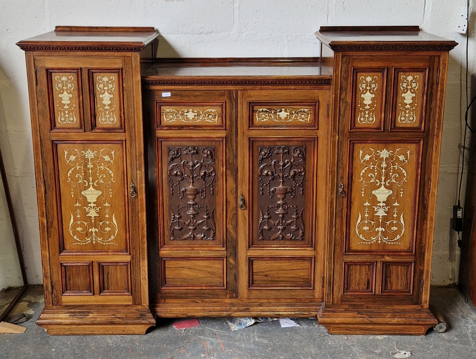 19th century rosewood and ivory inlaid cabinet, the ogee mould top above egg and dart cornice, the