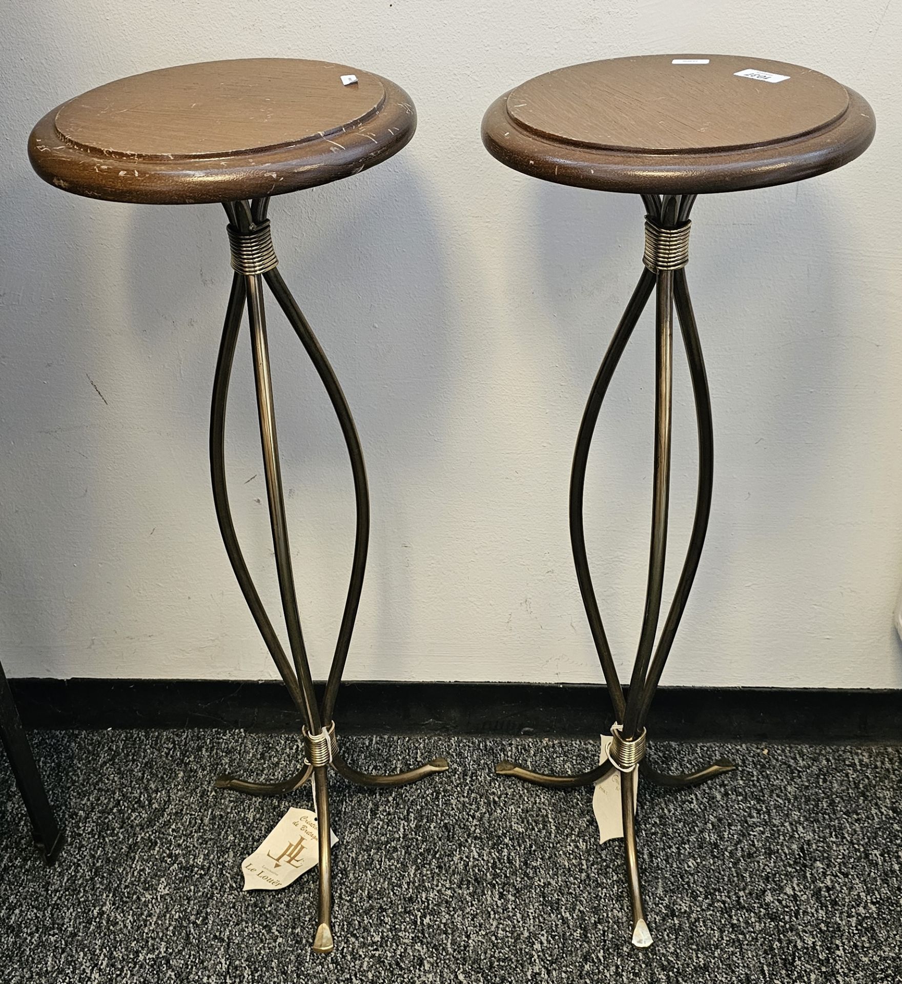 Pair of contemporary torchere stands on stylised brass-effect tripod legs, each with makers label