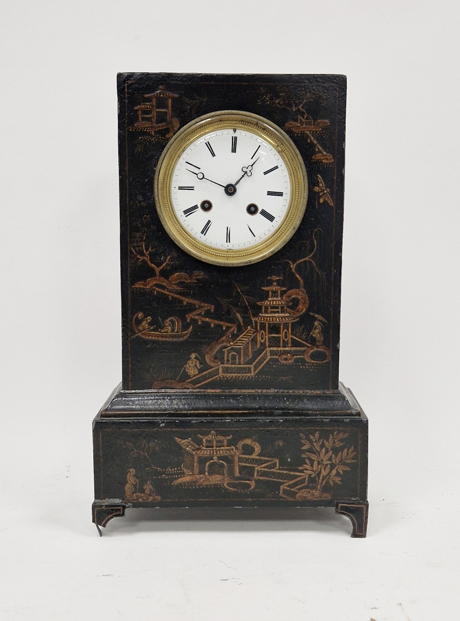 19th century Toleware mantel clock in chinoiserie decorated case, having white enamel circular