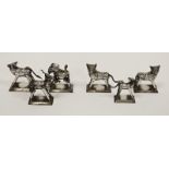 Six white metal models of animals including stylised donkeys, buffalo and cats, tallest 6cm high (6)