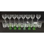 Eight Waterford wine glasses, panel cut bowls on faceted stems, etched marks, six early 20th century