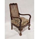 Rattan backed mahogany armchair on front claw and ball feet, 97cm high