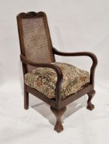 Rattan backed mahogany armchair on front claw and ball feet, 97cm high