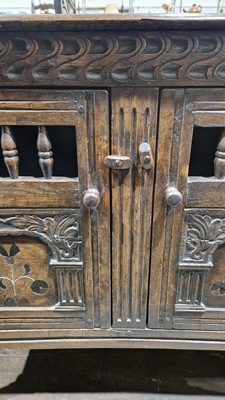 18th century oak dole cupboard, the two cupboard doors with turned spindle sections, carved and - Image 9 of 25