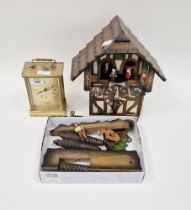 Painted wood cuckoo clock with figures and weights and a London Clock Company battery-operated