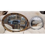 Gilt and ebonised wall mirror of oval form with bevelled edge, 76cm wide x 57cm high and a smaller