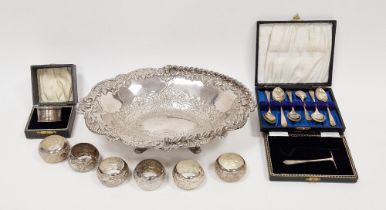 Early 20th century cased silver napkin ring, a selection of white metal napkin rings, a set of six