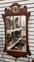 Early Georgian-style mahogany gilt-framed mirror with eagle finial (lacking head), 95cm x 52cm