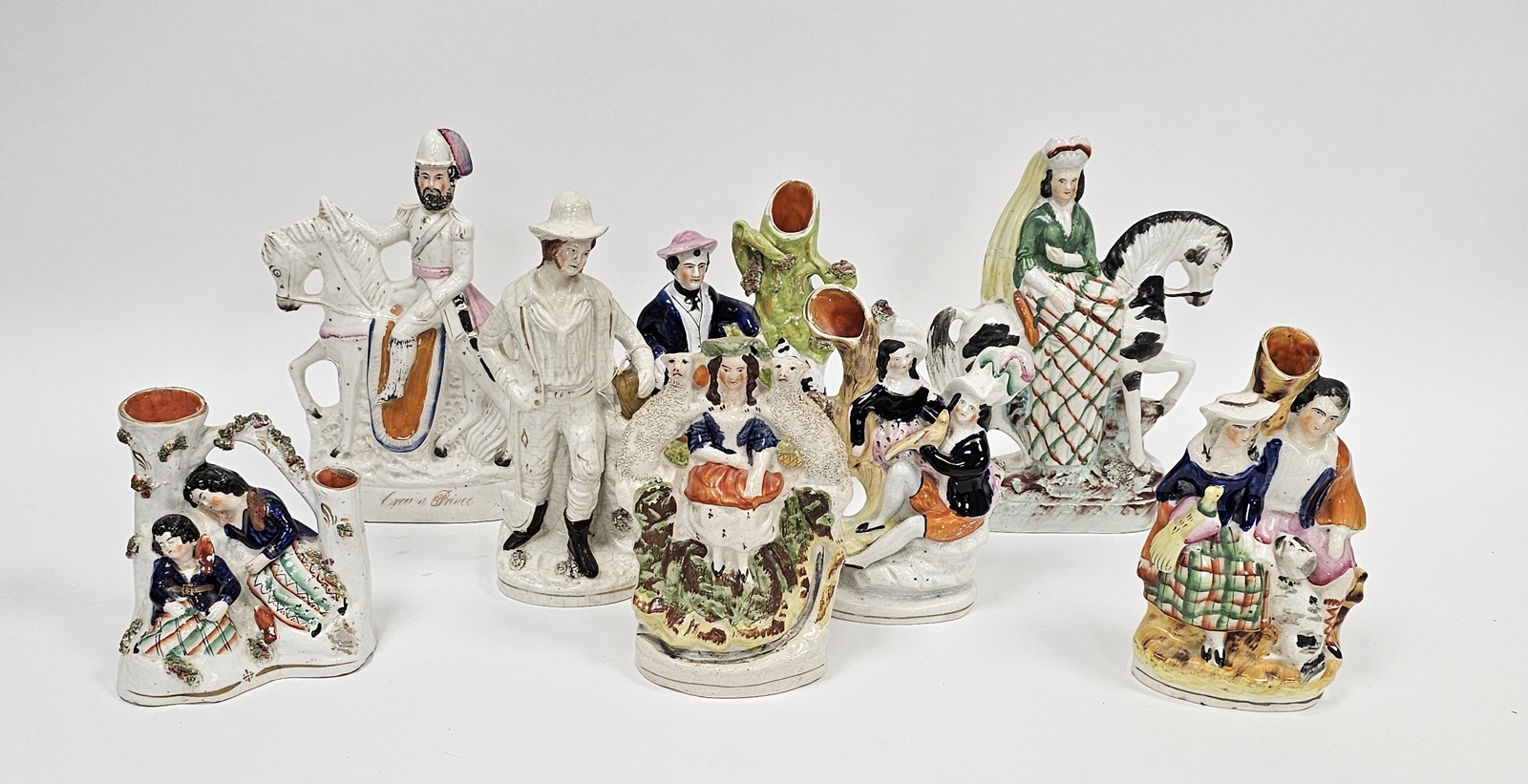 Collection of Victorian Staffordshire pottery flatback figures including two equestrian figures, one