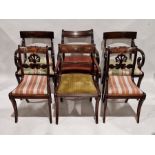 A group of 19th century mahogany dining chairs, five with bar backs and scroll arms, on outswept