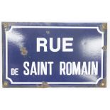 Vintage enamel French street sign, named for Rue de Saint Romain, reserved against a blue ground and