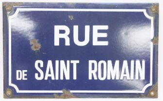 Vintage enamel French street sign, named for Rue de Saint Romain, reserved against a blue ground and