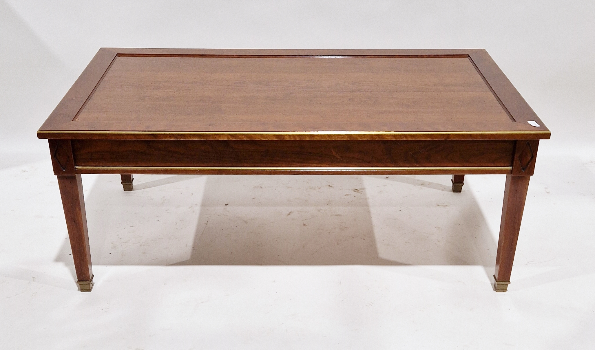 Modern stained wooden coffee table by Grange of rectangular form with gilt detailed borders, 47cm