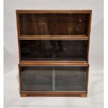 Three-section stacking glazed bookcase, each tier with two sliding glass doors, 114cm high x 89cm