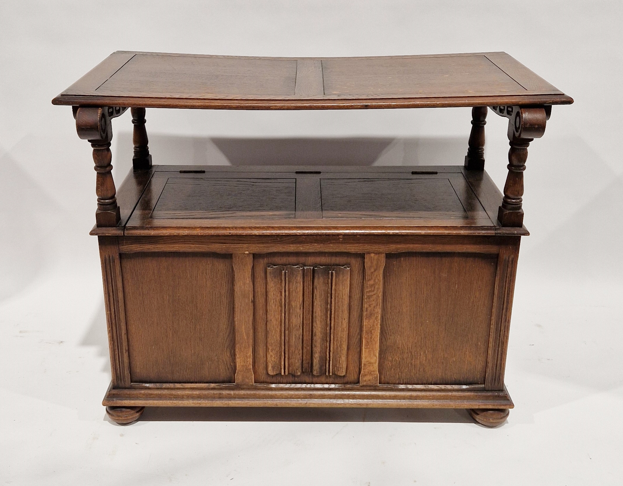 Reproduction carved oak monk's bench with linenfold panelling to the hinged table-top/seat back, - Image 2 of 2