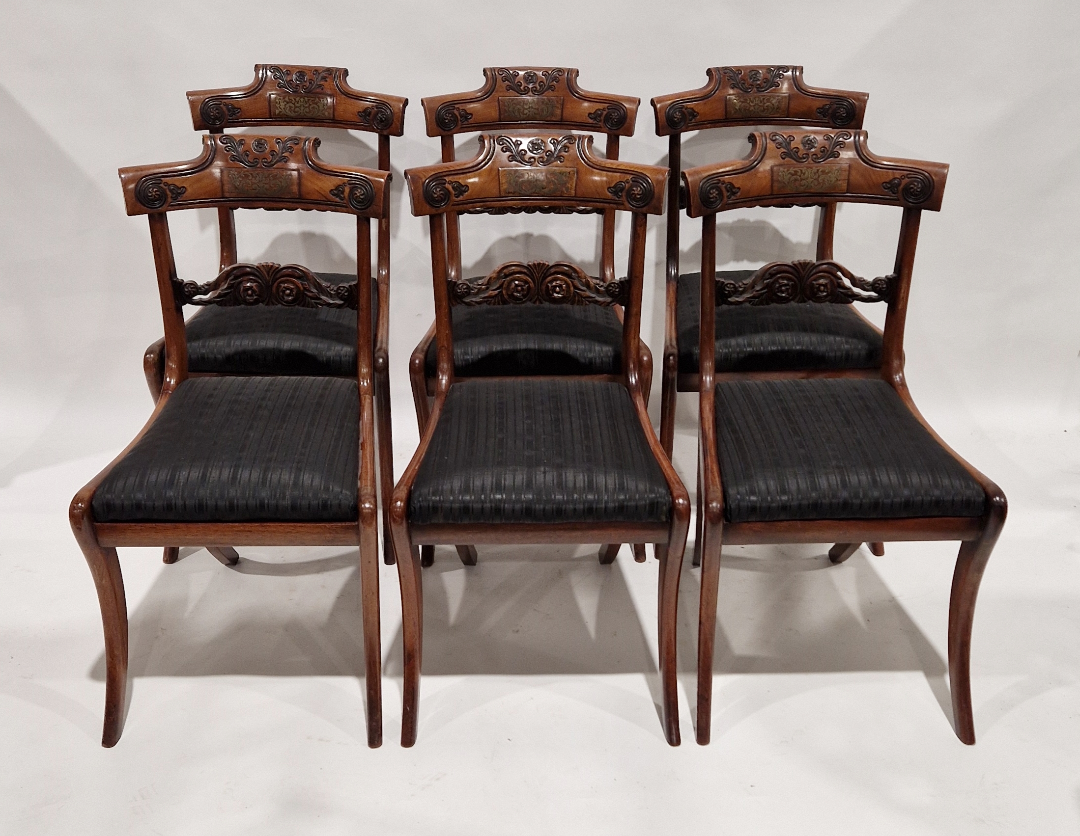 Set of six Regency brass inlaid rosewood dining chairs, each with scroll top rail with raised scroll