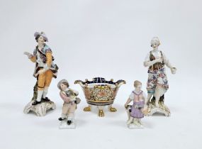 Pair of late 19th century Berlin-style figures in the Meissen-style decorated with flowers on gilt