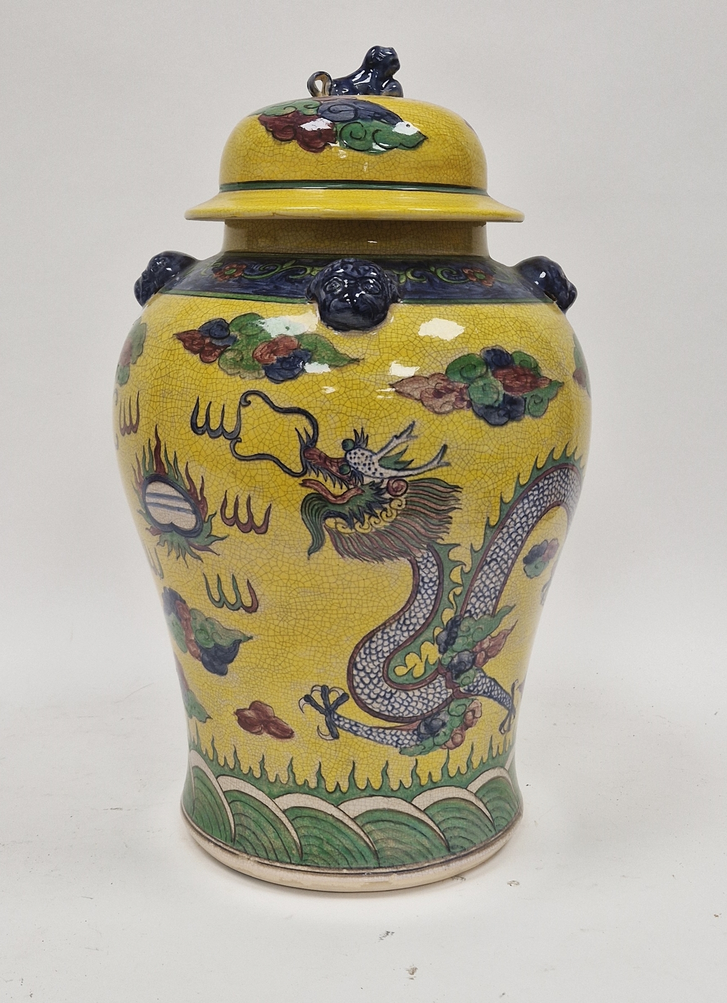 Contemporary Chinese-style baluster yellow ground jar and cover, decorated with a scrolling dragon