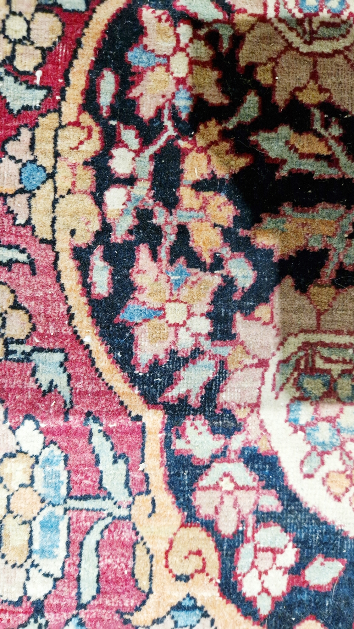 Eastern wool rug of Persian design, having black arabesque to the cherry red field with allover - Image 14 of 32